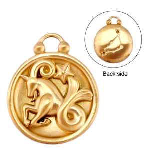 Detail of double-sided 18k gold Capricorn pendant showing embossed logo and star map