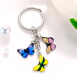 Detail view of colorful butterfly keychain with blue, orange, and yellow pendants