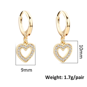 Macro detail of gold heart earrings with zircon inlay showing dimensions 9mm and 10mm