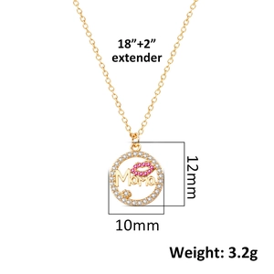Macro detail of 'Mama' gold necklace with pink lip charm and white crystals decoration