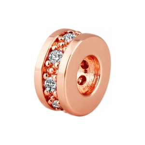 Détail d'une perle d'espacement roue plaquée or rose avec zircons pour création de bijoux
