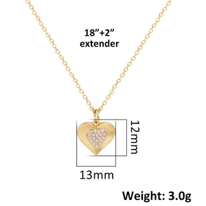 Detailed view of a gold heart pendant with radial texture and dimensions of 13mm by 12mm