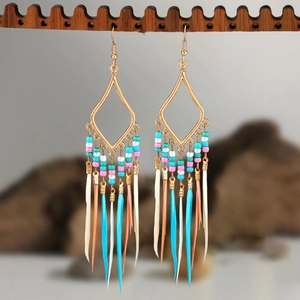 Bohemian geometric earrings with colorful beads and feather tassels on wood stand