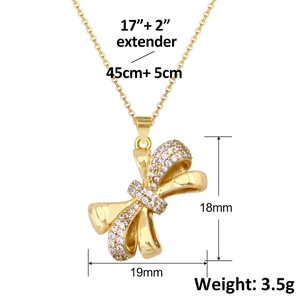 Gold bow pendant necklace with sparkling pavé zircons and adjustable cable chain link