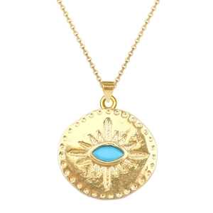 Detail view of gold coin necklace featuring hammered texture and inlaid blue evil eye stone