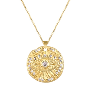 Detail of gold evil eye pendant with hammered texture and sparkling crystal inlay