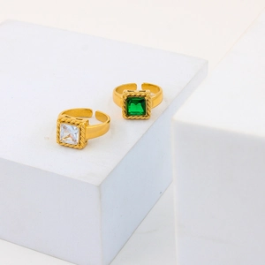 Adjustable gold vintage rings featuring square emerald and clear zircon stones with rope borders