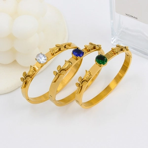 Three 18K gold-plated stainless steel rose bracelets with crystal gemstone accents