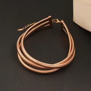Detailed view of rose gold triple-layer snake chain choker with K18 tag and lobster clasp