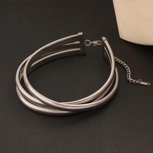 Detail of silver multi-layer choker showing flexible snake chain texture and clasp