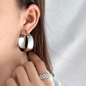 Minimalist silver wide hoop earring and textured ring set in polished stainless steel