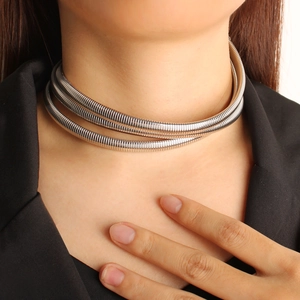 Three-layer silver stainless steel snake chain choker necklace worn on model neck