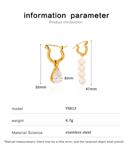 Detailed view of asymmetric gold stainless steel earrings with pearl and zircon charms