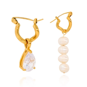 Elegant gold drop earrings set with a large teardrop zircon and vertical pearl string details