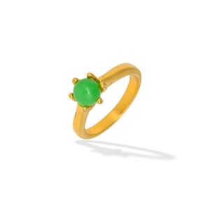Detail of vintage gold ring with six-prong set green cat-eye gemstone on white surface