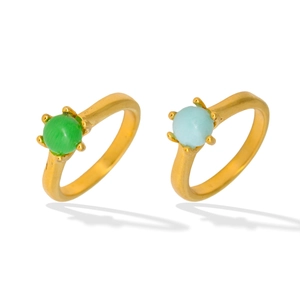 Vintage gold rings with emerald green and light blue gemstones in a classic claw setting