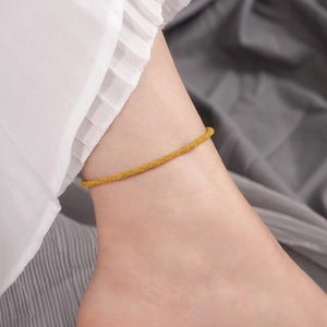 Elegant gold titanium steel anklet with shimmering frosted texture for a stylish summer look