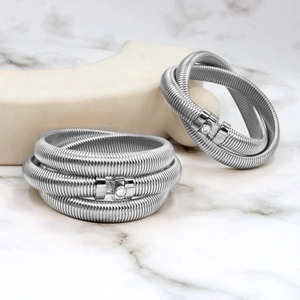 Silver spiral wrap bracelet with triple-layer coils and sparkling round zircon stone