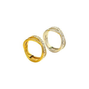 Cross-over knot titanium rings in gold and silver with sparkling zircon micro-pave setting