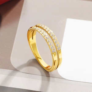 Close-up of double-layer gold ring with two rows of micro-pave white cubic zirconia