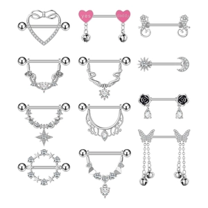 Set of 12 stainless steel nipple rings with heart and zircon designs on white background