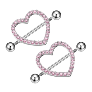 Detail view of heart-shaped nipple rings with pink cubic zirconia and silver steel