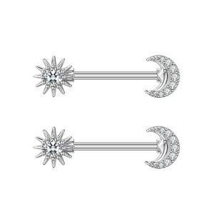 Macro detail of silver nipple rings featuring sun and crescent moon zircon patterns