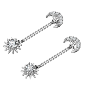 Detail of silver nipple rings with cubic zirconia moon and starburst pendants