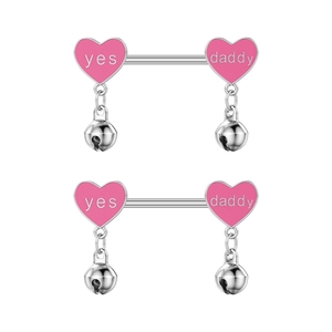 Pink heart-shaped nipple rings with Yes Daddy engraving and small dangling bells