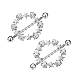 Macro view of silver star nipple shields with sparkling zircons and a polished finish