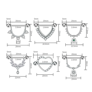 Detail view of various surgical steel nipple shields with green and white zircon accents