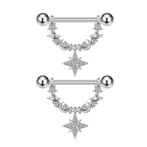 Macro detail of silver nipple rings with heart zircon and celestial star moon charms