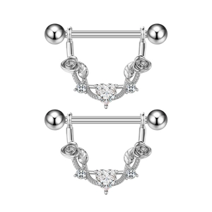Detail view of heart zircon nipple rings with silver roses and leaf accents