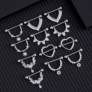 Surgical steel nipple rings set with lightning green zircon and sunburst designs