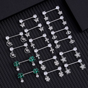 Stainless steel nipple barbells featuring butterfly, heart, and clover zircon pendants