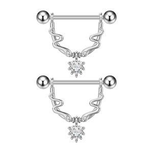Detail of silver nipple rings with heart-shaped zircon pendants and polished steel finish