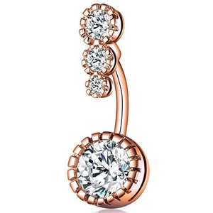 Macro detail of rose gold navel ring featuring four sparkling round cubic zirconia stones