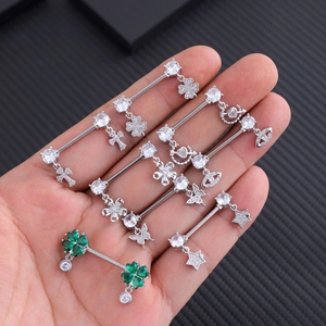 Set of stainless steel industrial barbells with clover, cross, and butterfly zirconia studs