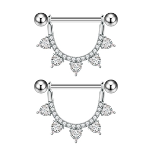 Detailed close-up of U-shaped silver nipple shield with heart and round zircon stones