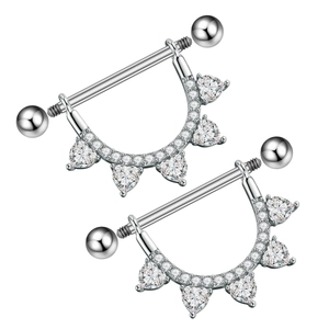 Macro detail of heart-shaped zircon nipple ring with sparkling crystal stones