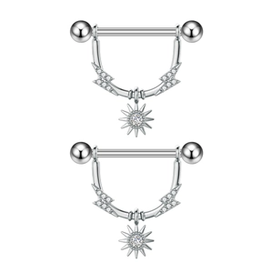 Detail of silver nipple rings with lightning bolts and starburst zircon pendants