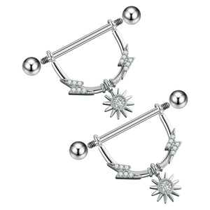 Macro detail of nipple shields featuring lightning bolt design and radiant sun pendants