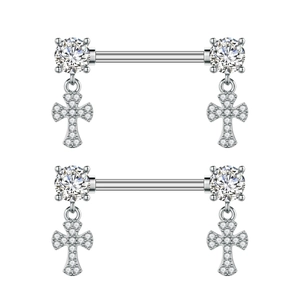 Macro detail of stainless steel nipple rings with zircon studs and dangling crosses