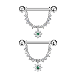 Detail of silver nipple rings with green zircon sunflower charms and clear stone chains