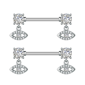 Detailed macro view of silver steel nipple rings with dangling zircon evil eye charms