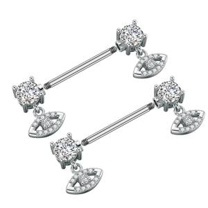 Close-up of stainless steel nipple rings with clear zircon stones and evil eye pendant