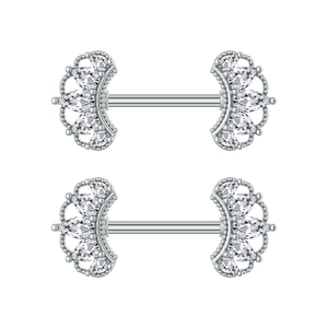 Macro detail of silver stainless steel nipple rings with pear-cut zircon fan accents