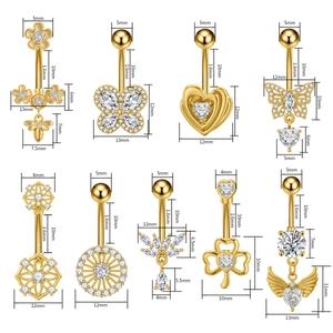 Detail of nine gold belly rings with zirconia charms and precise size measurements