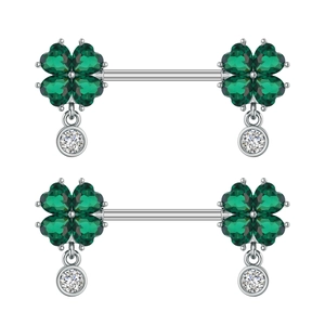 Detail of clover nipple rings with green heart stones and white dangling zircons