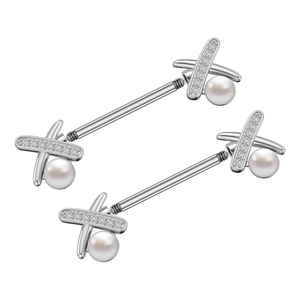 Detailed macro of silver stainless steel nipple rings with X-shape zircon and pearl